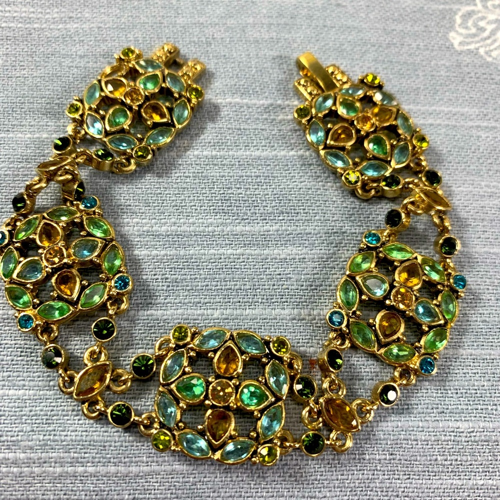 Monet bracelet gold tone, multi color faceted stones (1 missing)